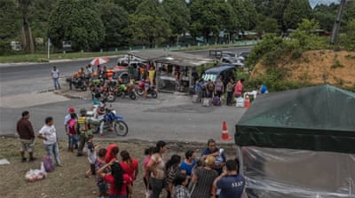 Relatives line up outside COMPAJ prison carrying essentials for the inmates, which should be provided by the state  [Tomasso Protti/Al Jazeera]