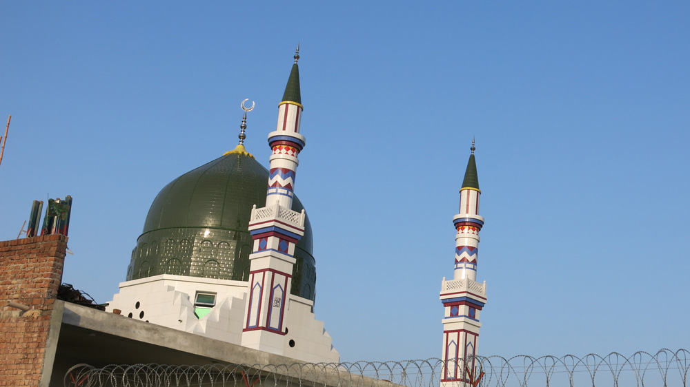 The shrine honours Mumtaz Qadri, a Pakistani police officer who shot dead the Punjab governor Salman Taseer over alleged blasphemy [Asad Hashim/Al Jazeera]