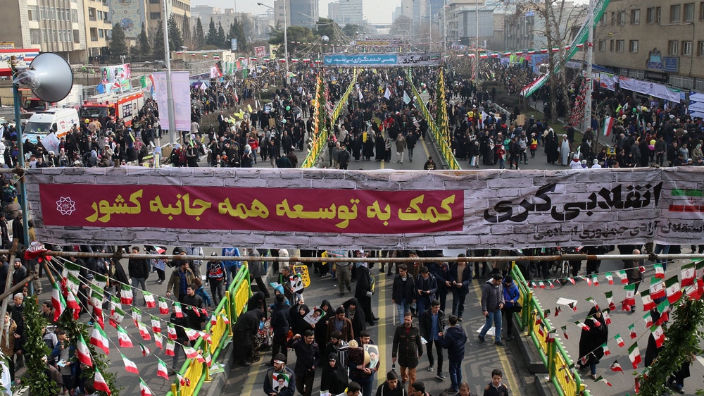 Marchers chanted traditional slogans against the United States and Israel during the march on Friday [Mohammad Ali Najib/Al Jazeera]