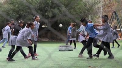 Children from Khan al-Ahmar playing outside their classrooms at a school also under threat of demolition [Ibrahim Husseini/Al Jazeera]