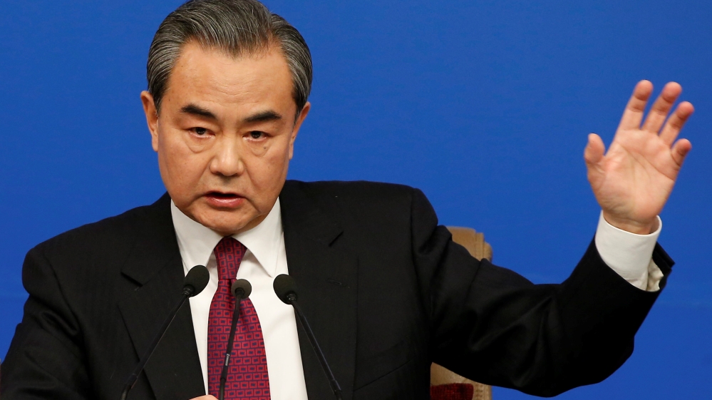 Chinese Foreign Minister Wang Yi attends a news conference at the annual session of the National People's Congress in Beijing on Wednesday [Reuters]