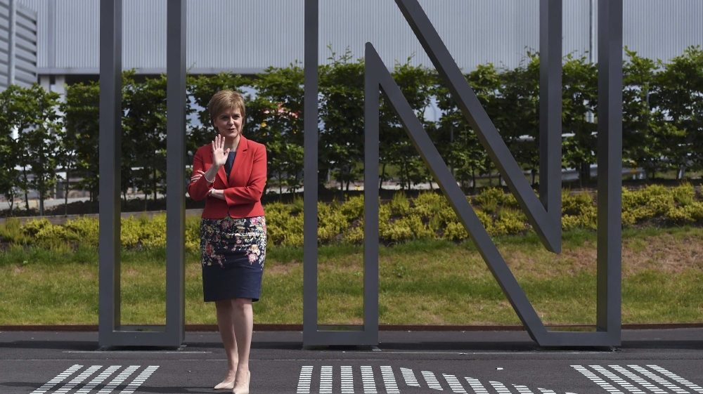 Nicola Sturgeon, the First Minister of Scotland, stands in front of a sign at a EU referendum remain event, at Edinburgh airport in Edinburgh