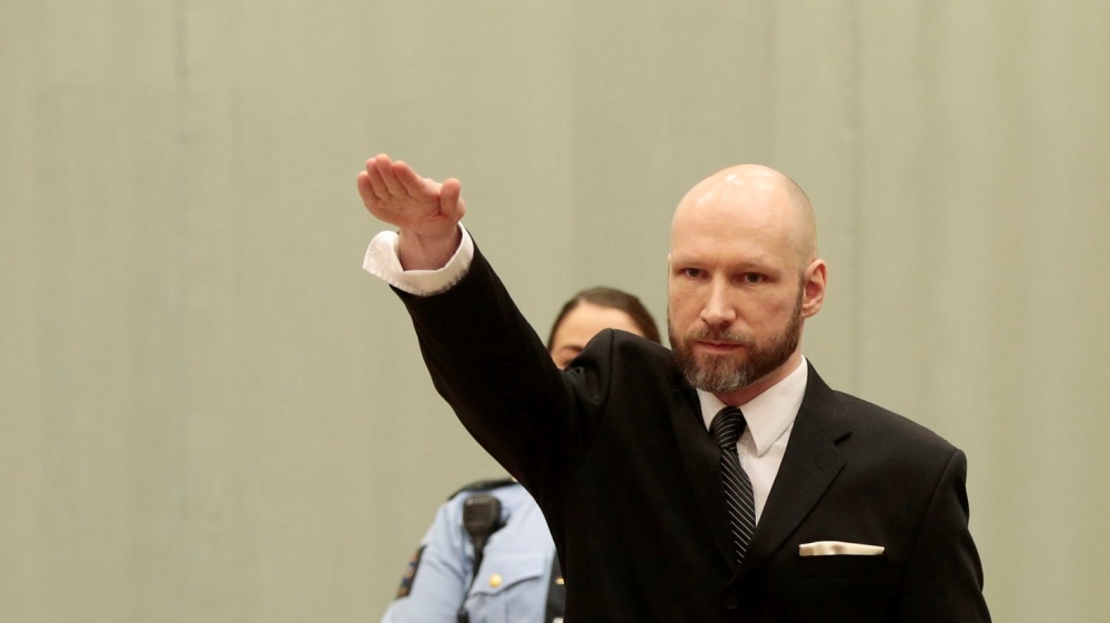Anders Behring Breivik raises his right hand during the appeal case in Borgarting Court of Appeal at Telemark prison in Skien