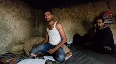 Foreman Faisal Razza shows the scars on his arm from self-harm [Will Horner/Al Jazeera]