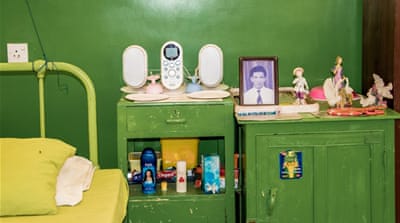 A picture of Edward de Alwis as a young man takes place of pride on his bedside table [Smriti Daniel/Al Jazeera]