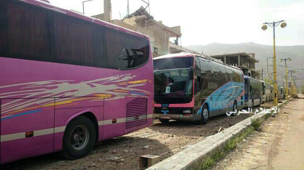 As part of the planned evacuation deal of the besieged areas, Syria's government and rebels exchanged some 30 prisoners [AP]