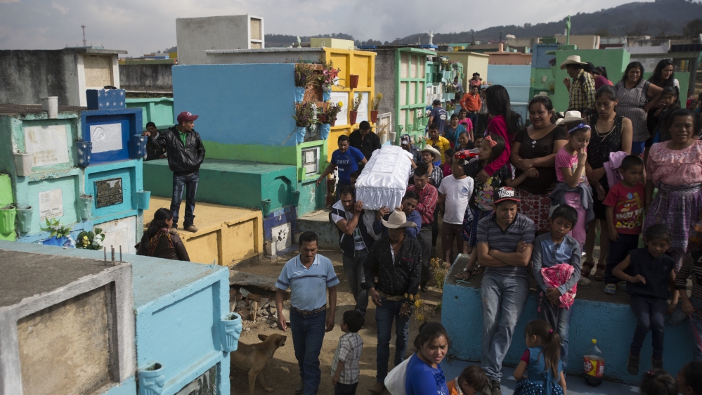 On March 12, people carry a coffin containing the remains of 14-year-old Ana Roselia Perez Junay, who died in a fire at the children's shelter, inside the cemetery in Zaragoza [AP/Moises Castillo]