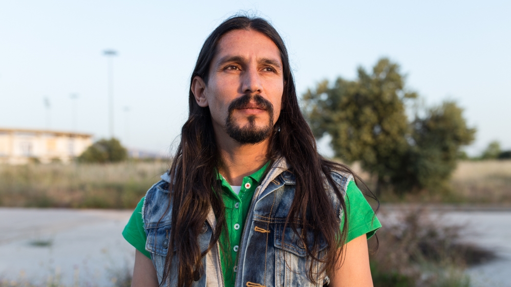 Mohamed Asif Ostadazimi lives in the Elliniko refugee camp with his wife and three children [Kelly Lynn Lunde/Al Jazeera]