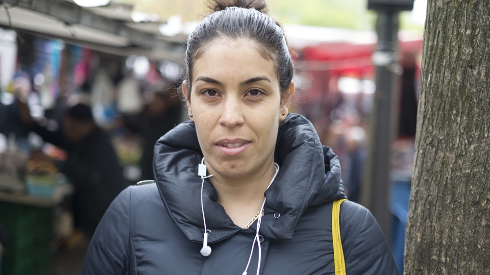 'I'm voting Macron. He defends immigration. He gives opportunities to everyone.' [Raymond Bobar/Al Jazeera]