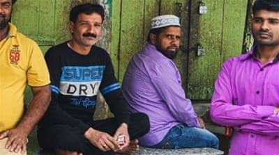 Meat sellers sit idle in Gudri Bazar of Meerut [Maya Prabhu/Al Jazeera]