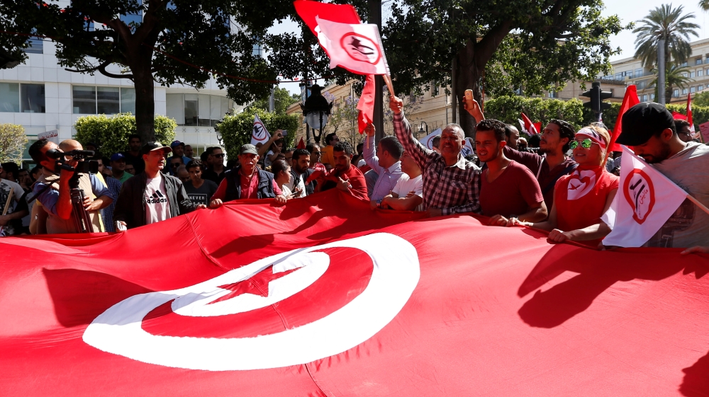 For many critics the law is simply an amnesty for criminals and a way to rehabilitate Ben Ali allies [Zoubeir Souissi/Reuters]