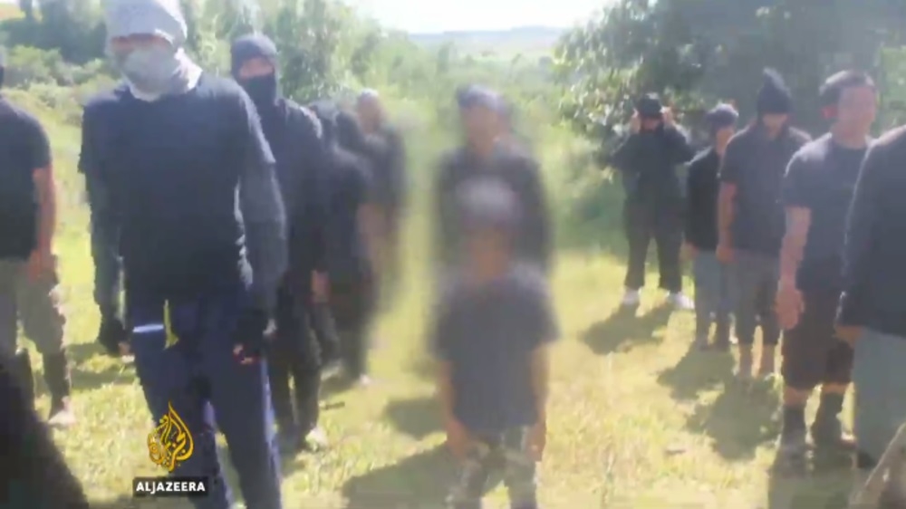  Images obtained by Al Jazeera show children being used as propaganda by ISIL-linked groups [Al Jazeera]