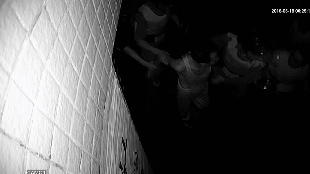 CCTV footage of Lin Zuluan's front gate shows the former village chief being taken away by authorities on June 18, 2016 [Screengrab/Al Jazeera]