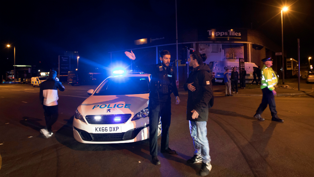 Police set up a cordon outside the Manchester Arena in northern England late on Monday [Jon Super/Reuters]
