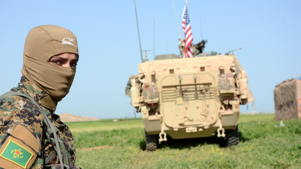 The Kurdish YPG militia and US military units patrol the Syrian-Turkish border