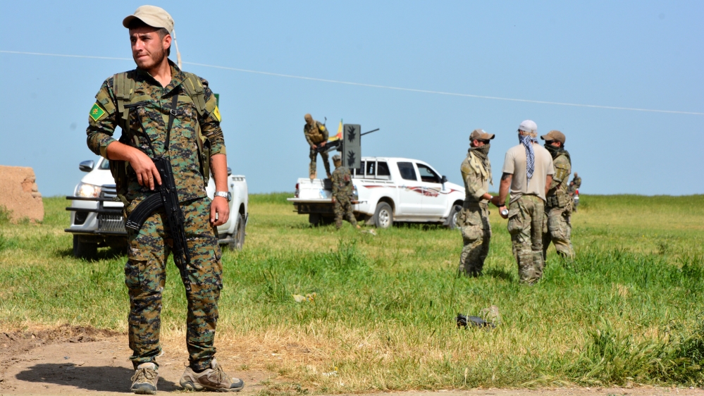 The Kurdish YPG militia and US military units patrol the Syrian-Turkish border