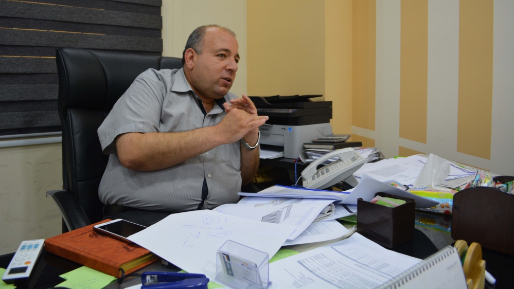 Ali Hussein is an engineer and the CEO of a store called Megapower in Gaza City that specialises in solar panels [Mersiha Gadzo/Al Jazeera]