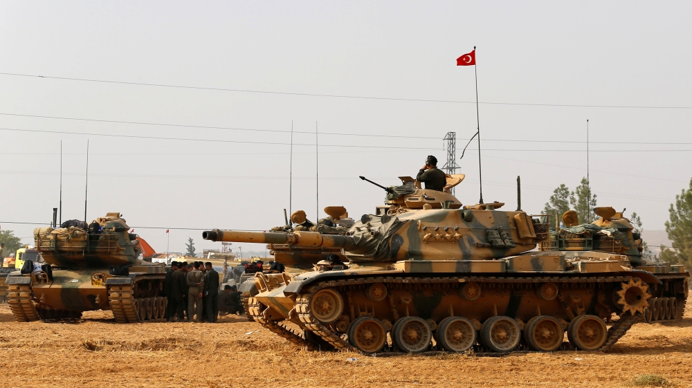 Turkish army tanks and military personal are stationed in Karkamis on the Turkish-Syrian border in the southeastern Gaziantep province