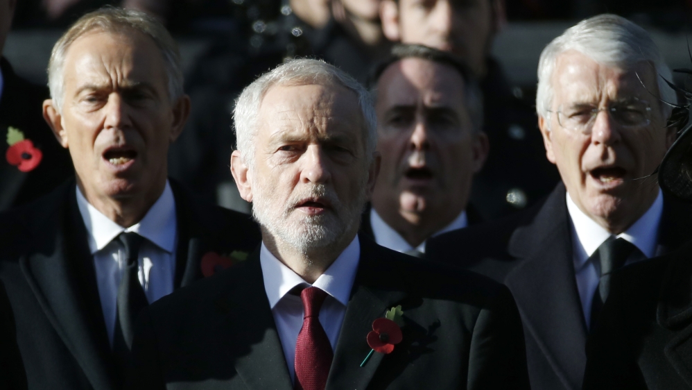 Former Prime Minister Tony Blair, left, drew the UK into New Labour's largest foreign affairs crisis, the invasion of Iraq in 2003 [Alastair Grant/AP]