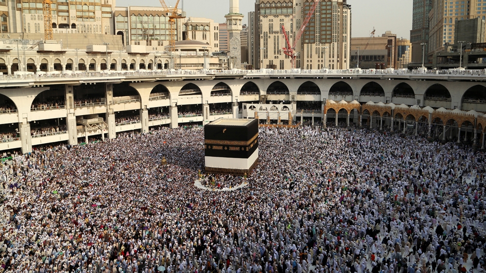 Muslim pilgrims circle the Kaaba at the Grand mosque in Mecca