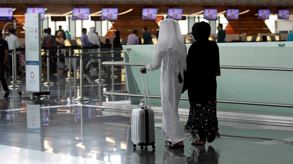 Passengers walk at Hamad International Airport in Doha