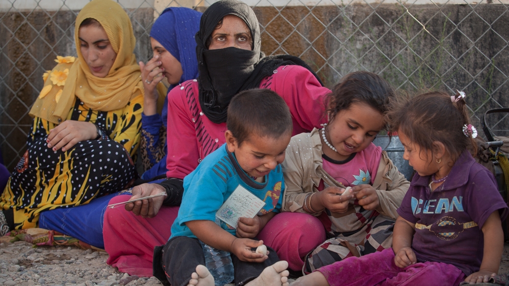 These women all denied having a family member in ISIL, but they were brought to the camp regardless [Sebastian Castelier/Al Jazeera]