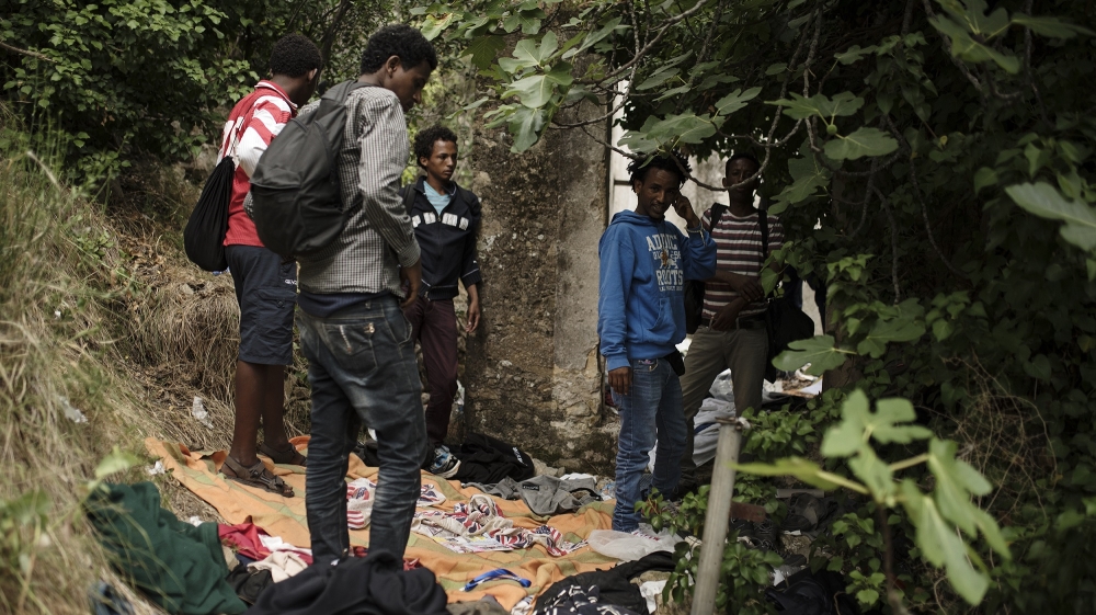 Eritrean refugees prepare to leave the farmhouse and hike the Pass of Death [Maurizio Martorana/Al Jazeera]