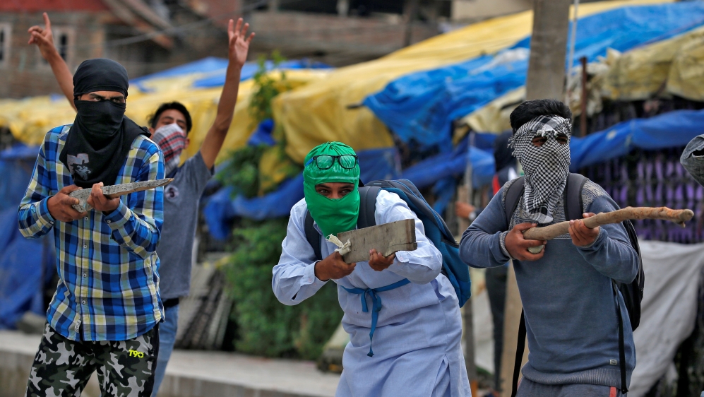 The Wider Image: Kashmir''s stone-pelters face off against pellet guns