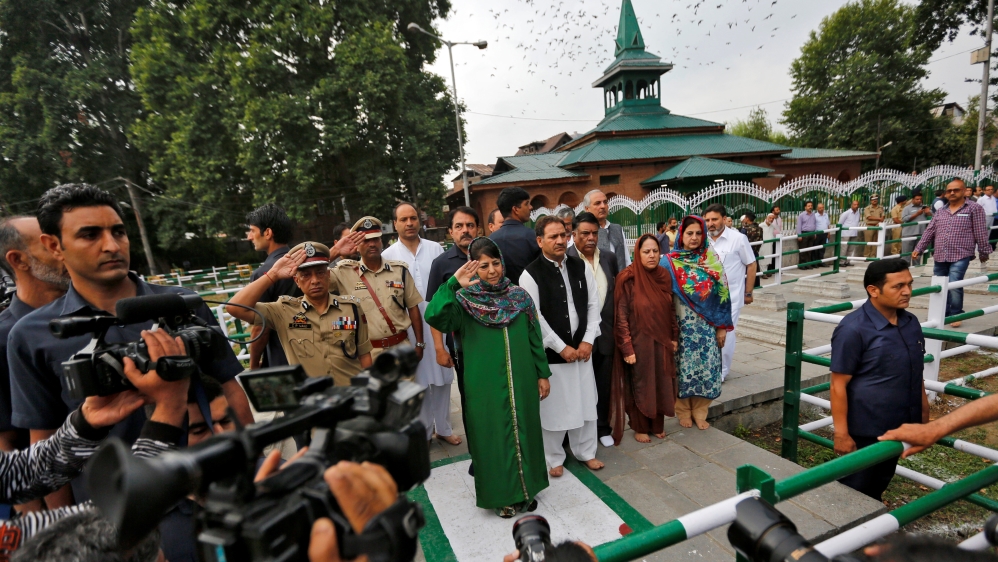 Jammu and Kashmir Chief Minister Mehbooba Mufti from the PDP salutes at the martyrs' graveyard during an event to mark Kashmir's Martyrs' Day in Srinagar, July 13, 2017 [Reuters/Danish Ismai]