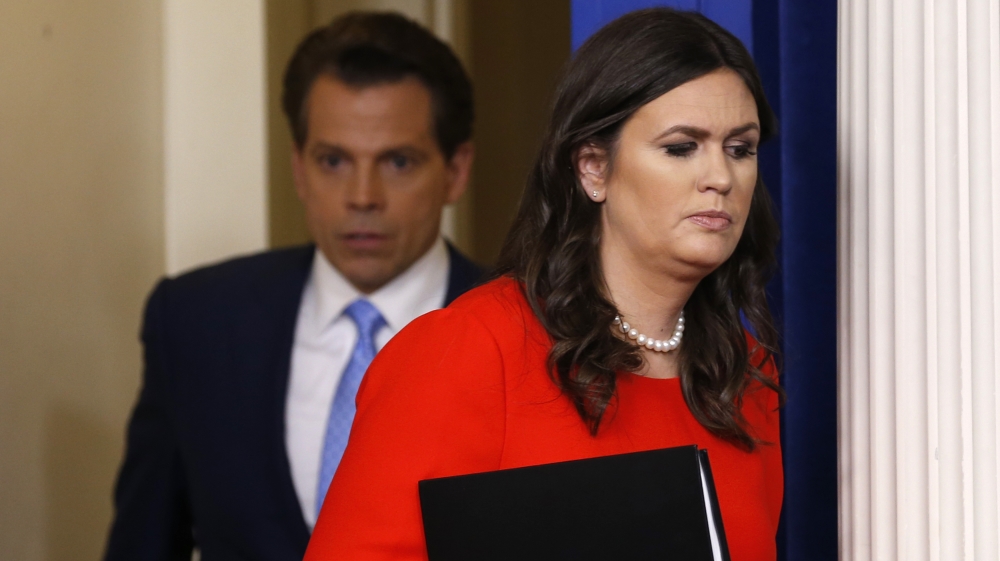 Sanders (right) and Scaramucci (left) spoke to reporters at the White House on Friday [Jonathan Ernst/Reuters]