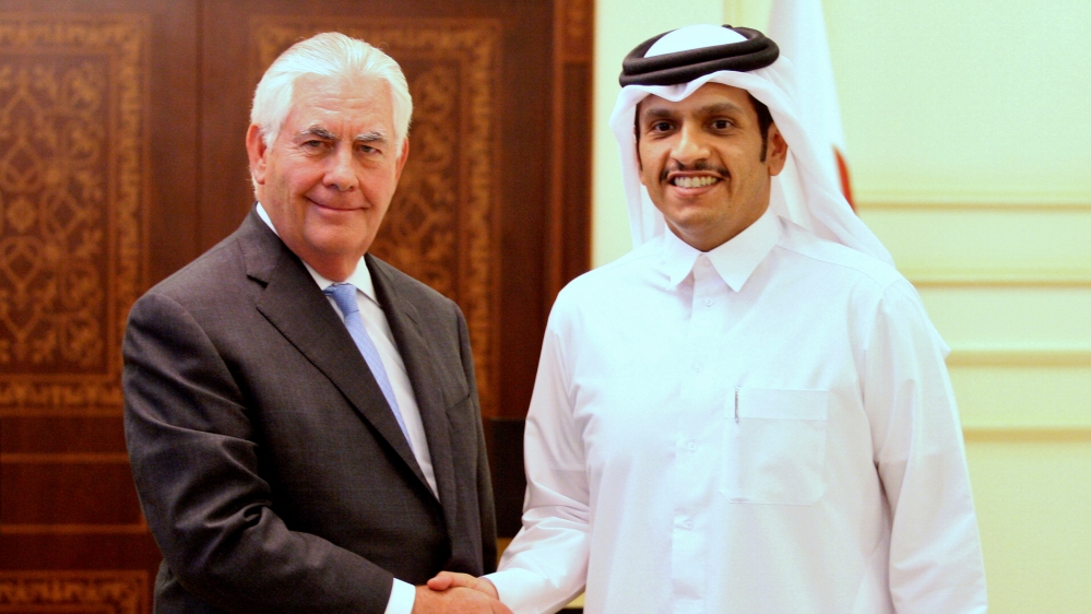 Qatar''s foreign minister Sheikh Mohammed bin Abdulrahman al-Thani (R) shakes hands with U.S. Secretary of State Rex Tillerson following a joint news conference in Doha