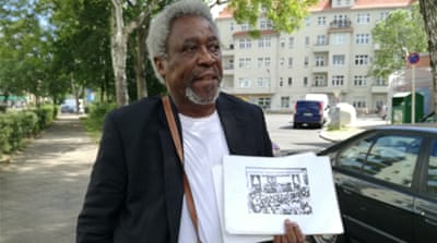 
Tanzanian-born campaigner Mnyaka Sururu Mboro recalls the personal stories of how the German empire affected his family [Gouri Sharma/Al Jazeera] 
