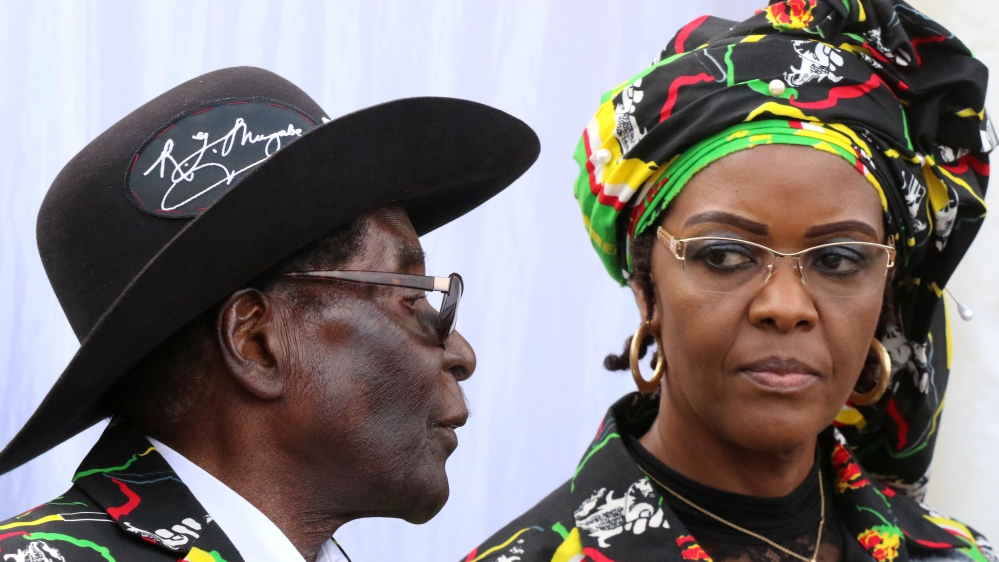 President Robert Mugabe and his wife Grace attend a rally of his ruling ZANU (PF) in Chinhoyi