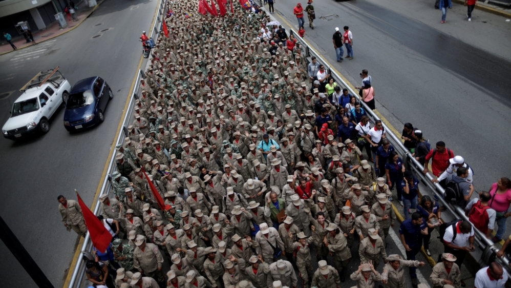 Pro-government supporters rally against US President Donald Trump in Caracas [Ueslei Marcelino/Reuters]