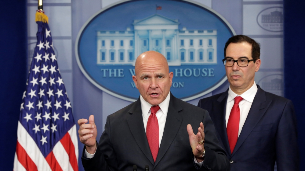 U.S. Treasury Secretary Mnuchin listens to National Security Adviser McMaster speak during a briefing at the White House in Washington