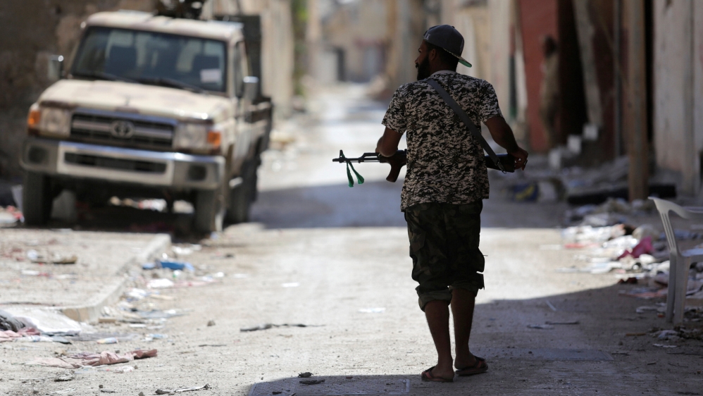 Member of the Libyan Army''s special forces holds his weapon during clashes with Islamist militants in the militants'' last stronghold in Benghazi