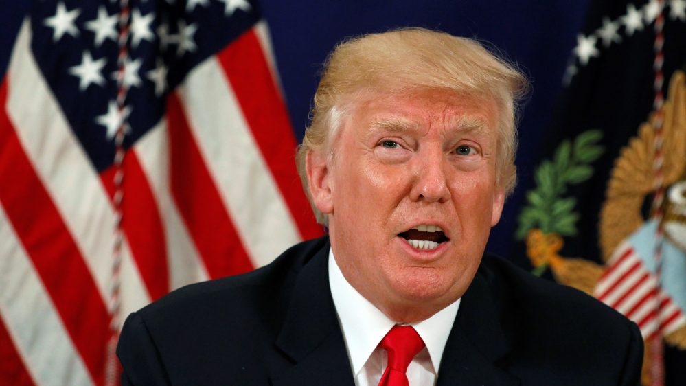Trump speaks to reporters after a security briefing at his golf estate in Bedminster, New Jersey