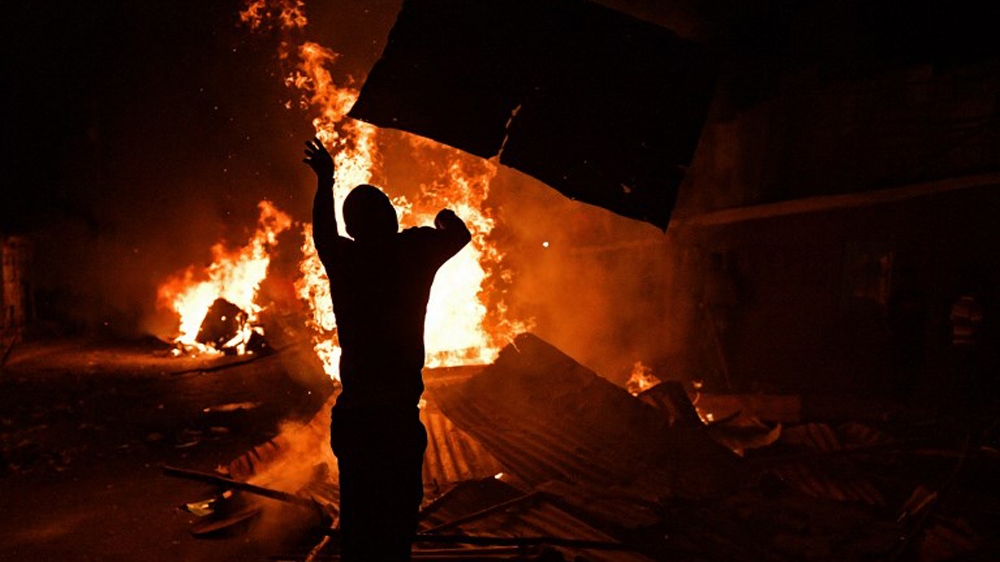 Protesters took to the streets of Nairobi as soon as Kenyatta was announced the winner [AFP]