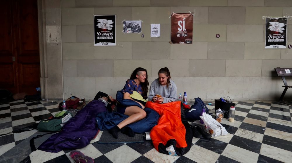 Some poll supporters spent the night inside the University of Barcelona's historic building [Susana Vera/Reuters]