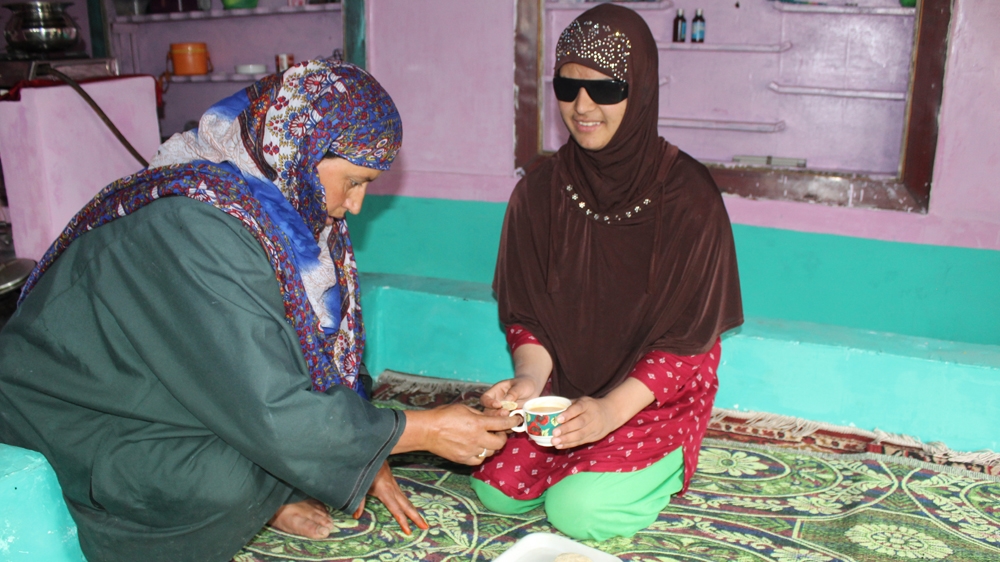 Isha Mushtaq says she misses seeing her parents' faces [Rifat Fareed/Al Jazeera]