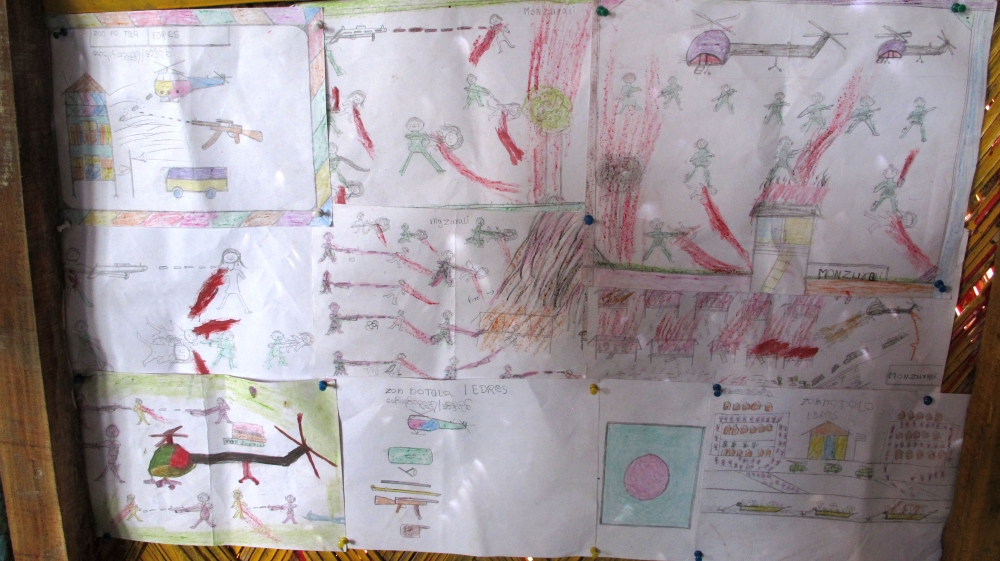 Rohingya children's drawings inside a child-friendly space co-run by CODEC and UNICEF in Balukhali refugee camp [Annette Ekin/Al Jazeera]