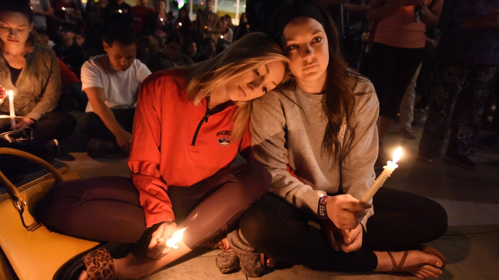 
People attend a candlelight vigil at the University of Las Vegas student union [Robyn Beck/AFP/Getty Images]

A candlelight vigil was held on the Las Vegas strip following the mass shooting [Chris Wattie/Reuters] 

A candlelight vigil was held on the Las Vegas strip following the mass shooting [Chris Wattie/Reuters] 