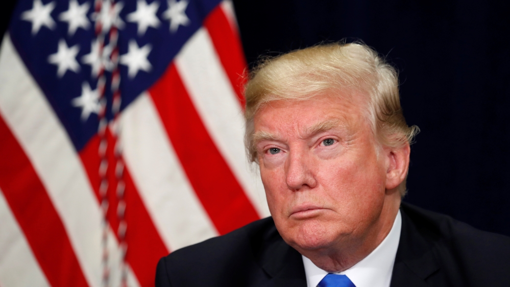 U.S. President Donald Trump attends a briefing on hurricane recovery efforts in Dallas, Texas