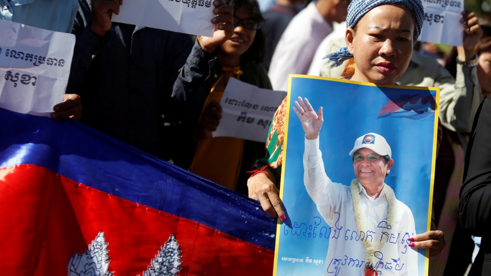 Supporters of Kem Sokha stand outside the Appeal Court during a bail hearing for the jailed opposition leader in Phnom Penh