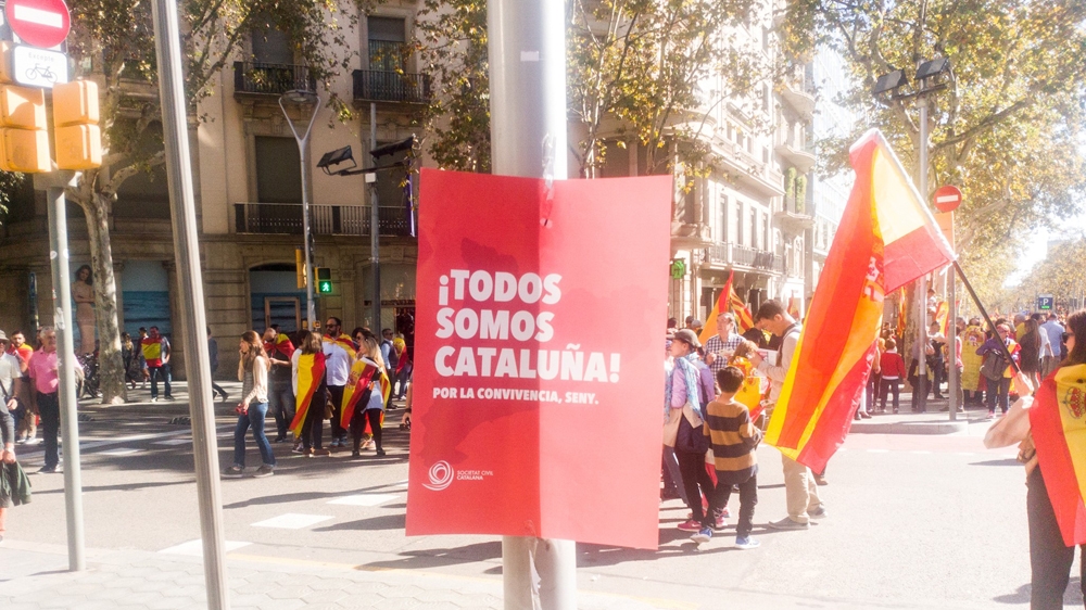 Marchers are moving from the Passage of Gracia, one of Barcelona's main streets, to the Plaça de Catalunya, the city's central transportation vein. [Creede Newton/Al Jazeera]