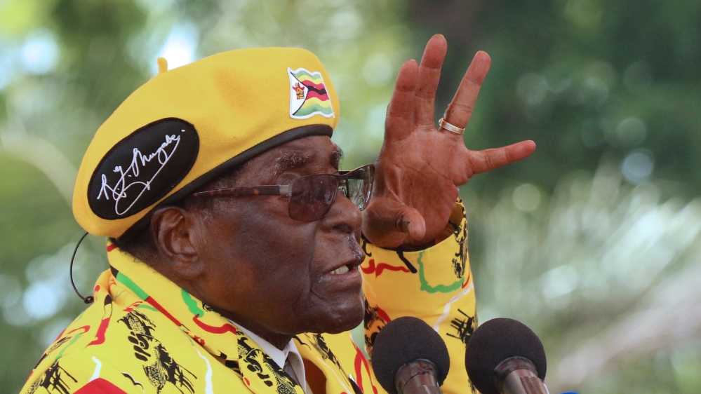 President Robert Mugabe gestures as he addresses a rally in Harare