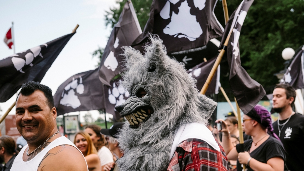 Supporters of La Meute march during a protest in Quebec City in August to demand stronger border controls [Renaud Philippe/Reuters]
