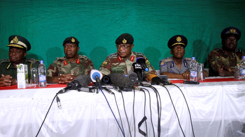 Commander of Zimbabwe Defence Forces General Chiwenga (C) addresses the media with other security chiefs in Harare