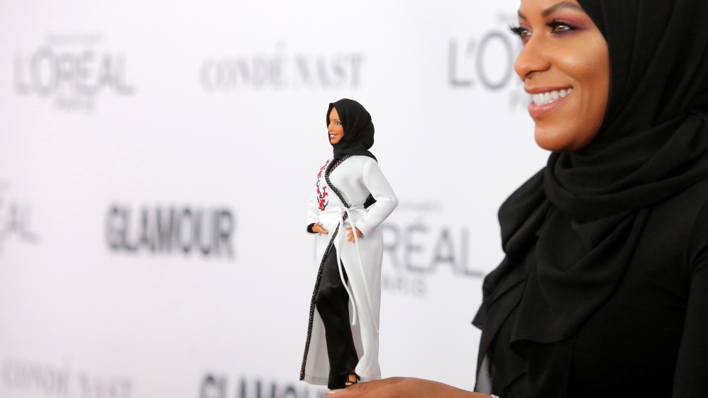 Olympic fencer Ibtihaj Muhammad holds a Barbie doll made in her likeness as she attends the 2017 Glamour Women of the Year Awards at the Kings Theater in Brooklyn, New York.