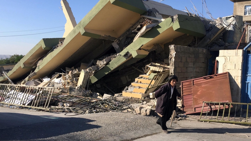 
A man walks past a collapsed building following an earthquake in Darbandikhan in Sulaimaniyah Governorate, Iraq [Ako Rasheed/Reuters]

Survivors sit in front of a destroyed house on the earthquake site in Sarpol-e-Zahab in western Iran [Vahid Salemi/AP Photo]

Iranian victims of the earthquake mourn around the wreckage of their home in the city of Pole-Zahab, in Kermanshah Province. [Abedin Taherkenareh/EFE/EPA]

Iranians walking past the rubble of buildings in Kouik village near to Sarpol-e Zahab. [Atta Kenare/AFP]

Survivors sit in front of a destroyed house on the earthquake site in Sarpol-e-Zahab in western Iran [Vahid Salemi/AP Photo]

Iranian victims of the earthquake mourn around the wreckage of their home in the city of Pole-Zahab, in Kermanshah Province. [Abedin Taherkenareh/EFE/EPA]

Iranians walking past the rubble of buildings in Kouik village near to Sarpol-e Zahab. [Atta Kenare/AFP]

Iranian victims of the earthquake mourn around the wreckage of their home in the city of Pole-Zahab, in Kermanshah Province. [Abedin Taherkenareh/EFE/EPA]

Iranians walking past the rubble of buildings in Kouik village near to Sarpol-e Zahab. [Atta Kenare/AFP]

Iranians walking past the rubble of buildings in Kouik village near to Sarpol-e Zahab. [Atta Kenare/AFP]